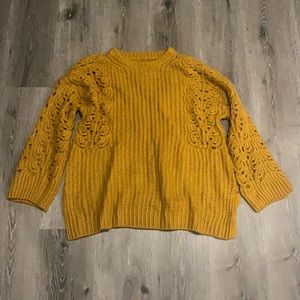 mustard anthropologie sweater XS but can fit up to a size medium :)